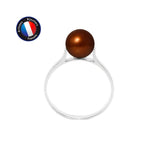 La Bague DUCHESSE de Perlinea présente une seule perle de culture chocolatée ronde sertie sur de l'or blanc. Un badge bleu dans le coin indique "Artisan Bijoutier Français", le tout sur fond blanc.