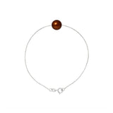 Le bracelet Perlinea Argent & Perle de Culture Chocolat - 8/9mm est composé d'une délicate chaîne en argent 925 avec une seule perle ronde d'eau douce chocolat, sécurisée par un fermoir lobster et un anneau de saut, présenté sur un fond blanc.