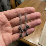 Pendientes colgantes en oro blanco y perla cultivada de Tahití negra